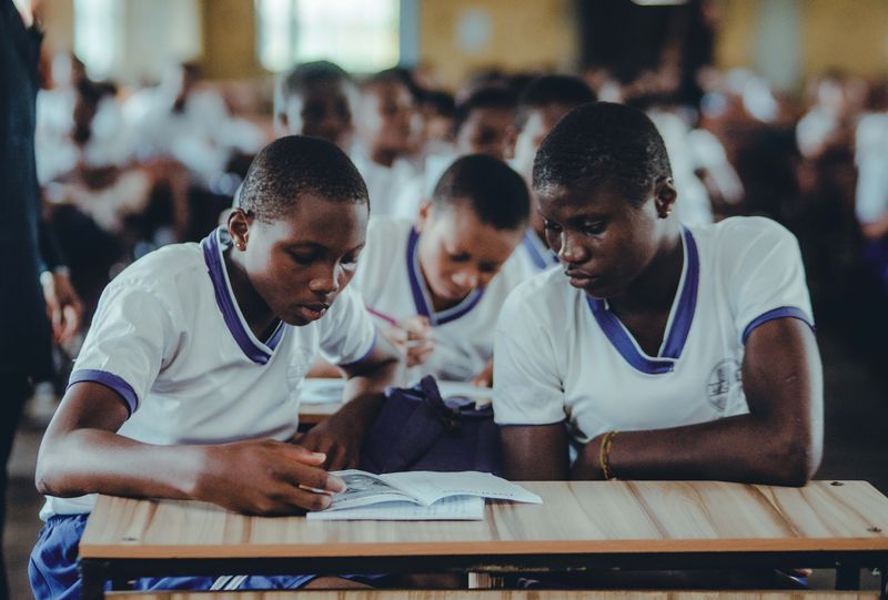 Students in uniform studying in a classroom