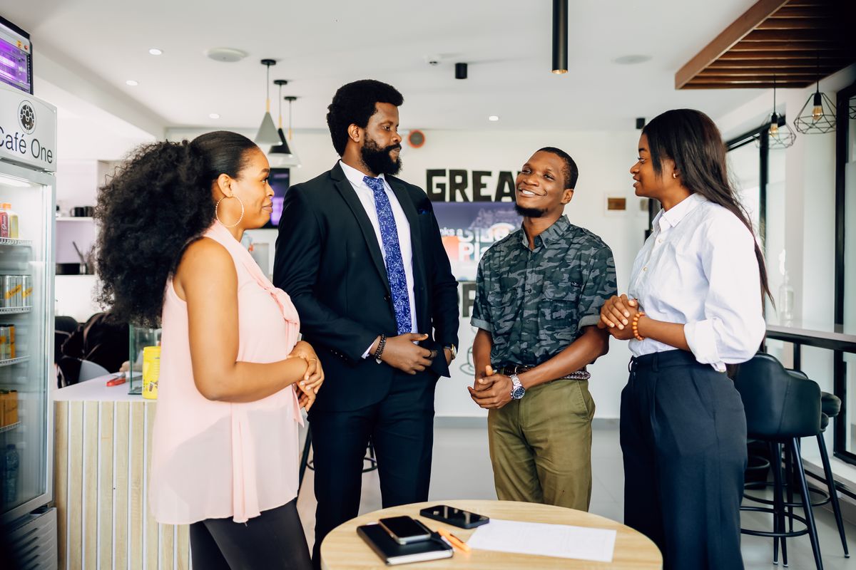 PayTraka users discussing their invoices in an office